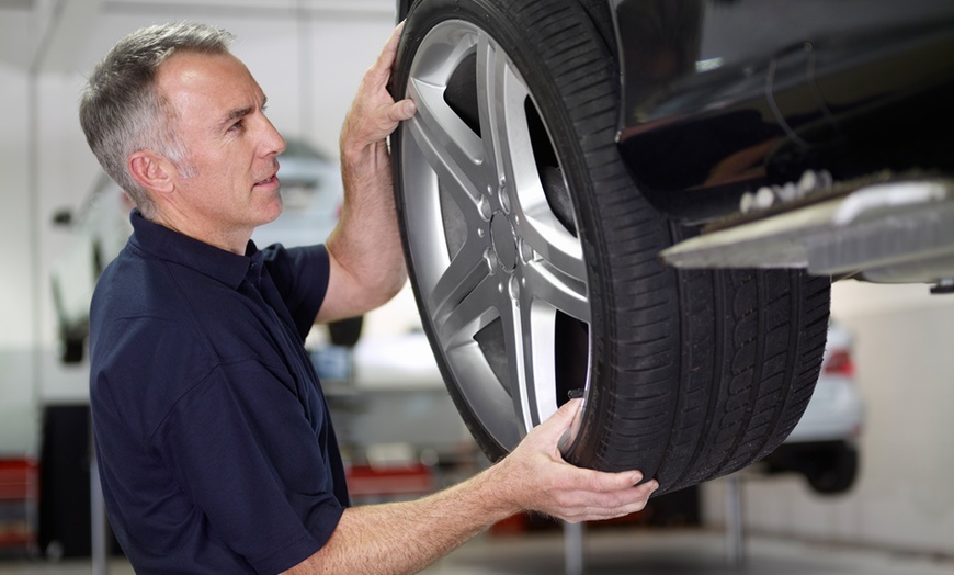 Image 1: 46% Off a 4-Wheel Alignment from Nick's Precision Transmission